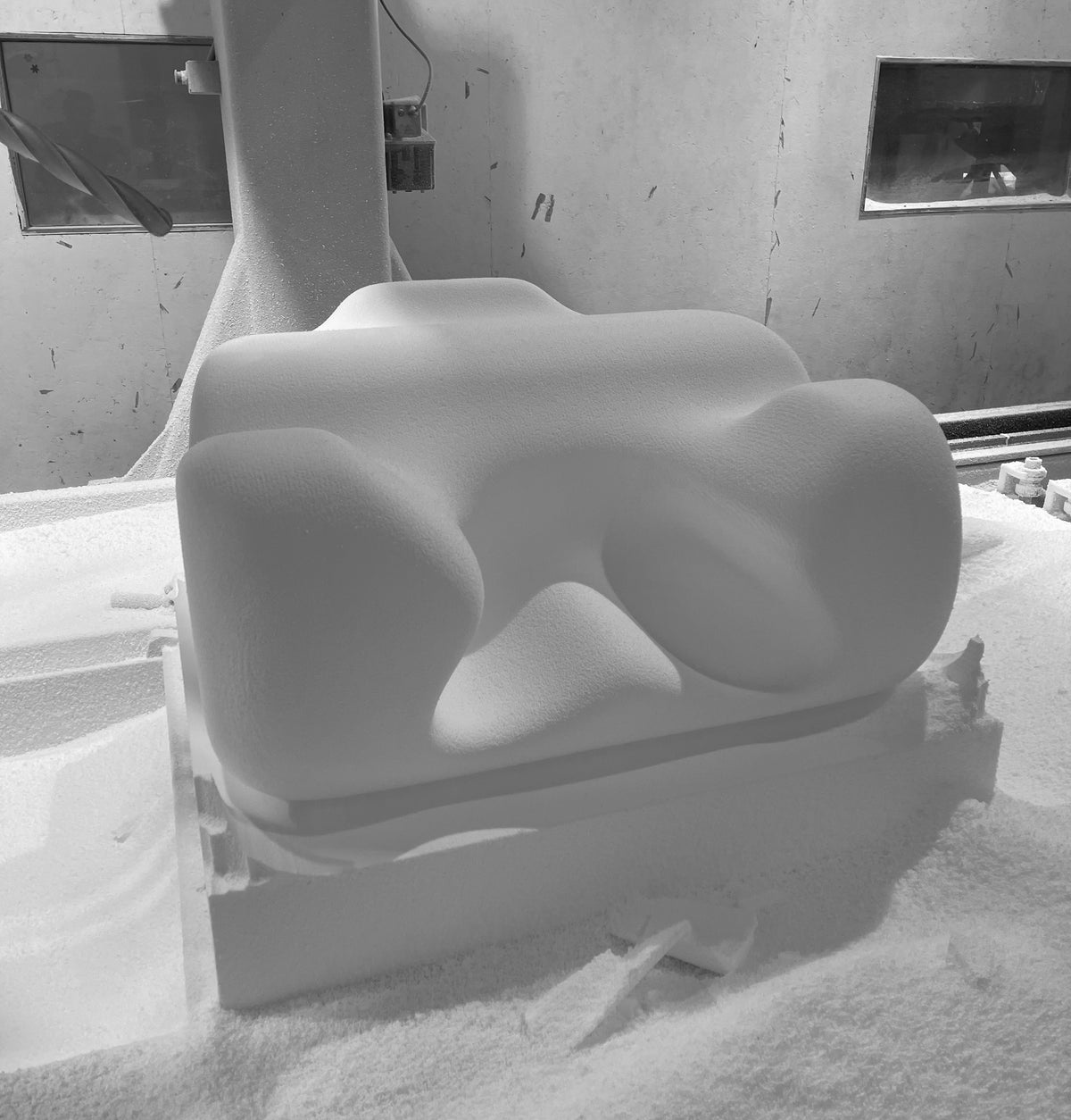 An early Oyster Meditation Chair foam prototype being shaped in the workshop