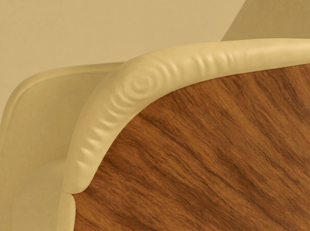 Close view of Attune’s curved pale handrest meeting a dark timber outer surface