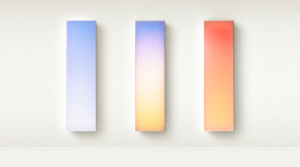 Three Circadia panels displaying cool, pastel and warm color gradients against a light wall