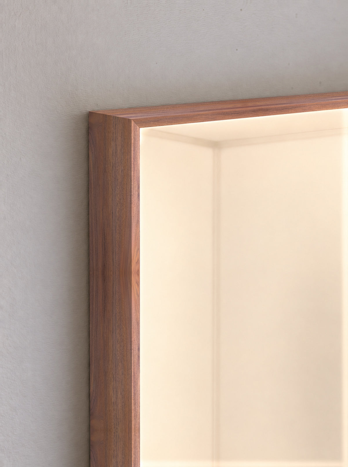 Circadia walnut frame corner with warm yellow light — illustrative finish detail